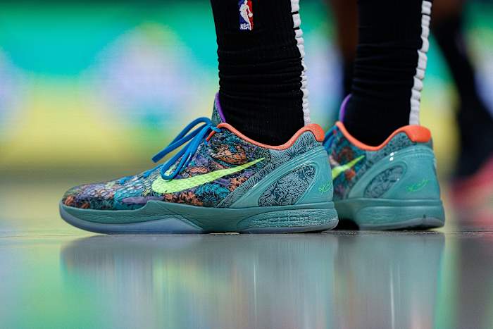 View of green and blue Nike Kobe shoes.